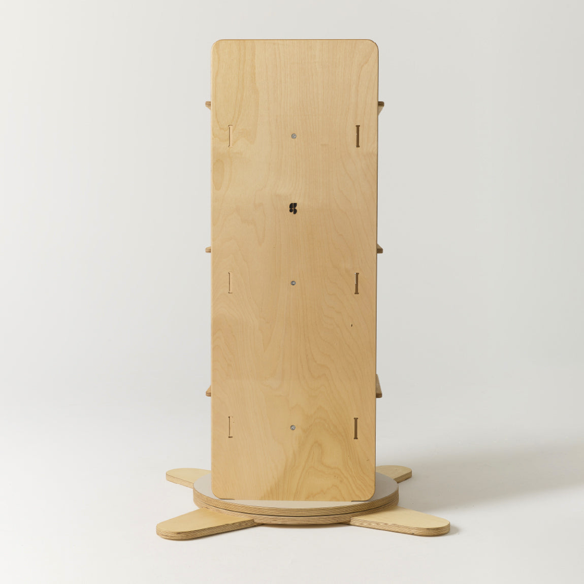 Wooden rotating bookshelf from the side on a white background