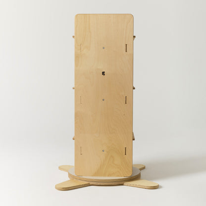 Wooden rotating bookshelf from the side on a white background